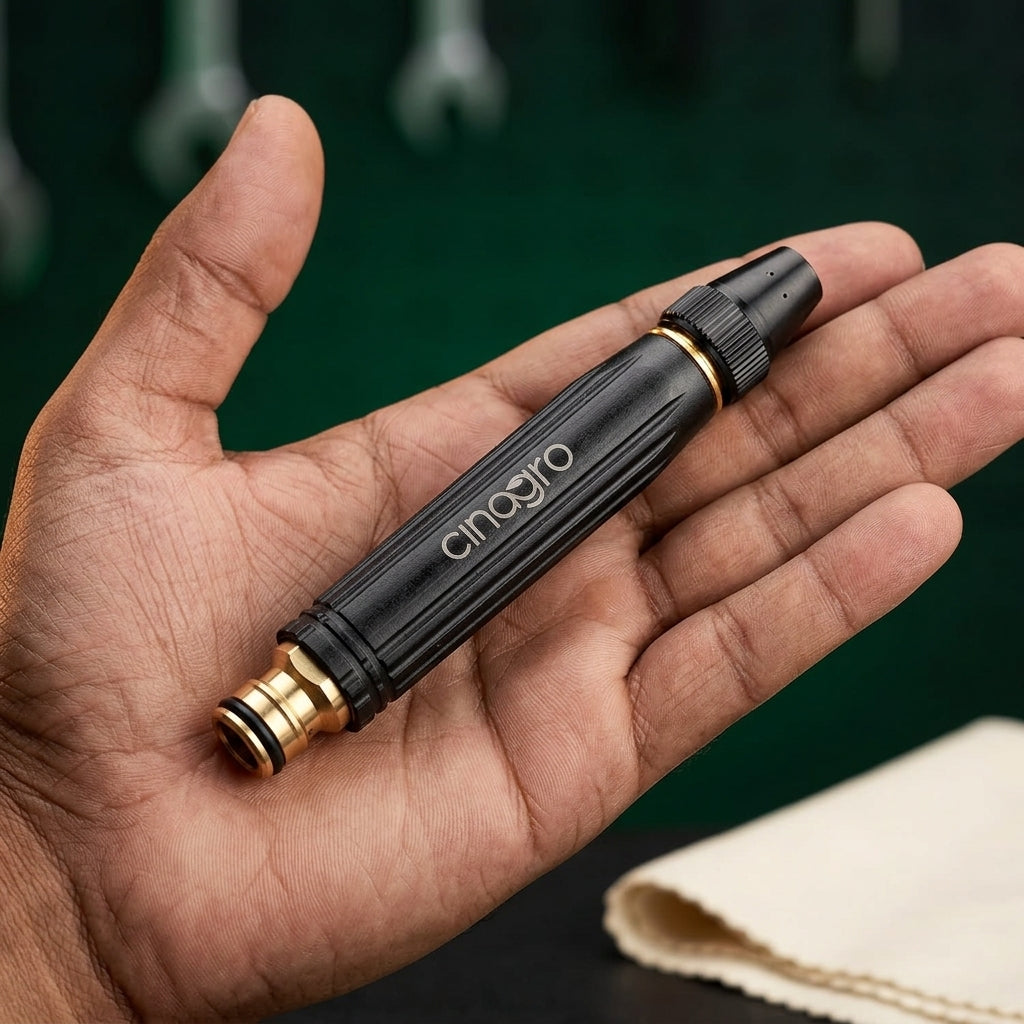 Compact palm-sized brass Jet Spray Gun showing solid build quality
